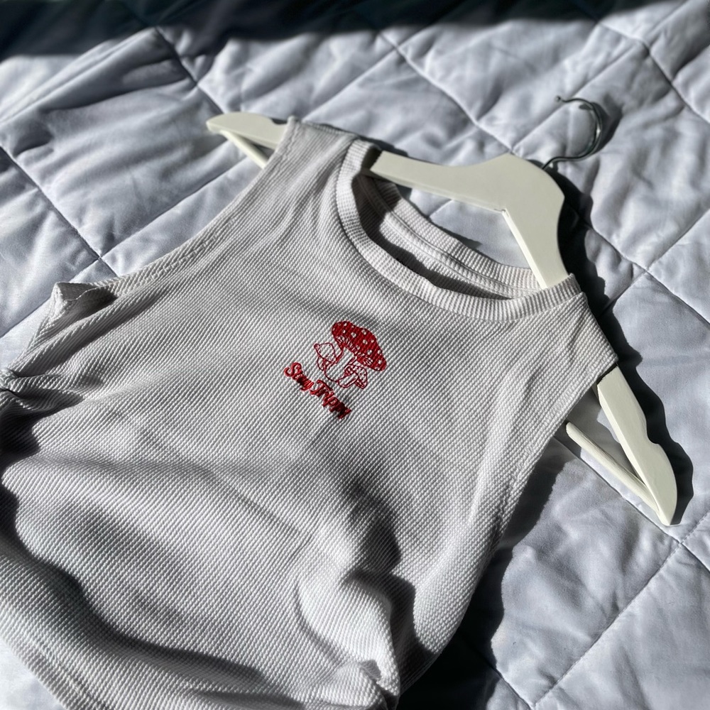 Its a fun Home girl society crop top , size medium and white in colour